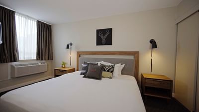 Bed in a room at One Bedroom King Mountain Suite at Adara Hotel