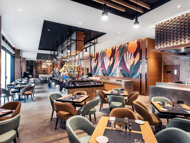A Stylish Pendas Cafe with a striking mural on the wall at the Sunway Hotel Big Box