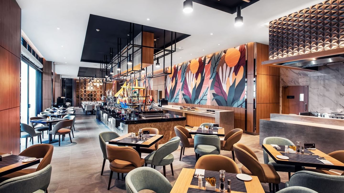 A Stylish Pendas Cafe with a striking mural on the wall at the Sunway Hotel Big Box