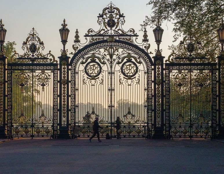 Magnificent golden ornate iron gates at the entrance of Parc de la Tête d'Or near Warwick Lyon