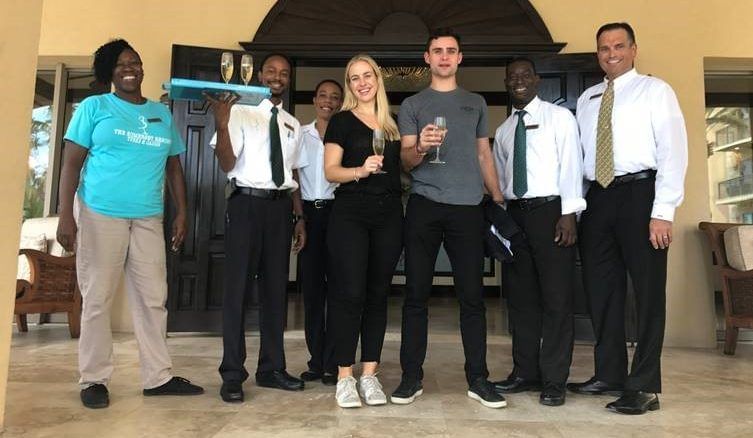 Staff members with guests at The Somerset on Grace Bay
