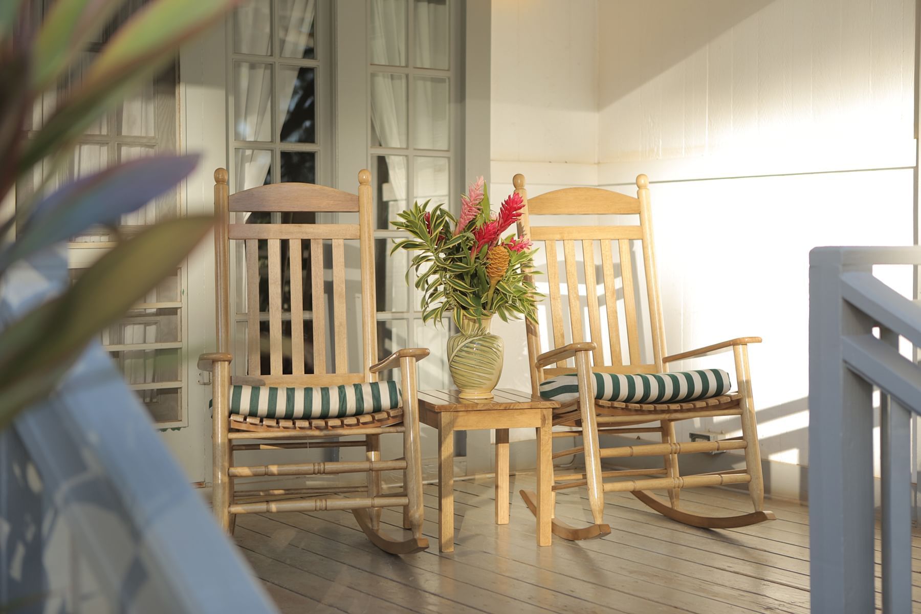 Rocking Chairs on a patio at Waimea Plantation Cottages