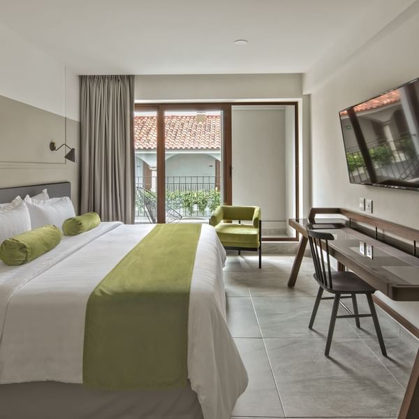 Deluxe Room Interior with balcony at Gamma Hotels