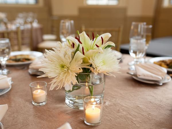 Flower & candle decors on a banquet table at Warwick Allerton