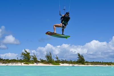 A lady kiteboarding near H2O Life Style Resort