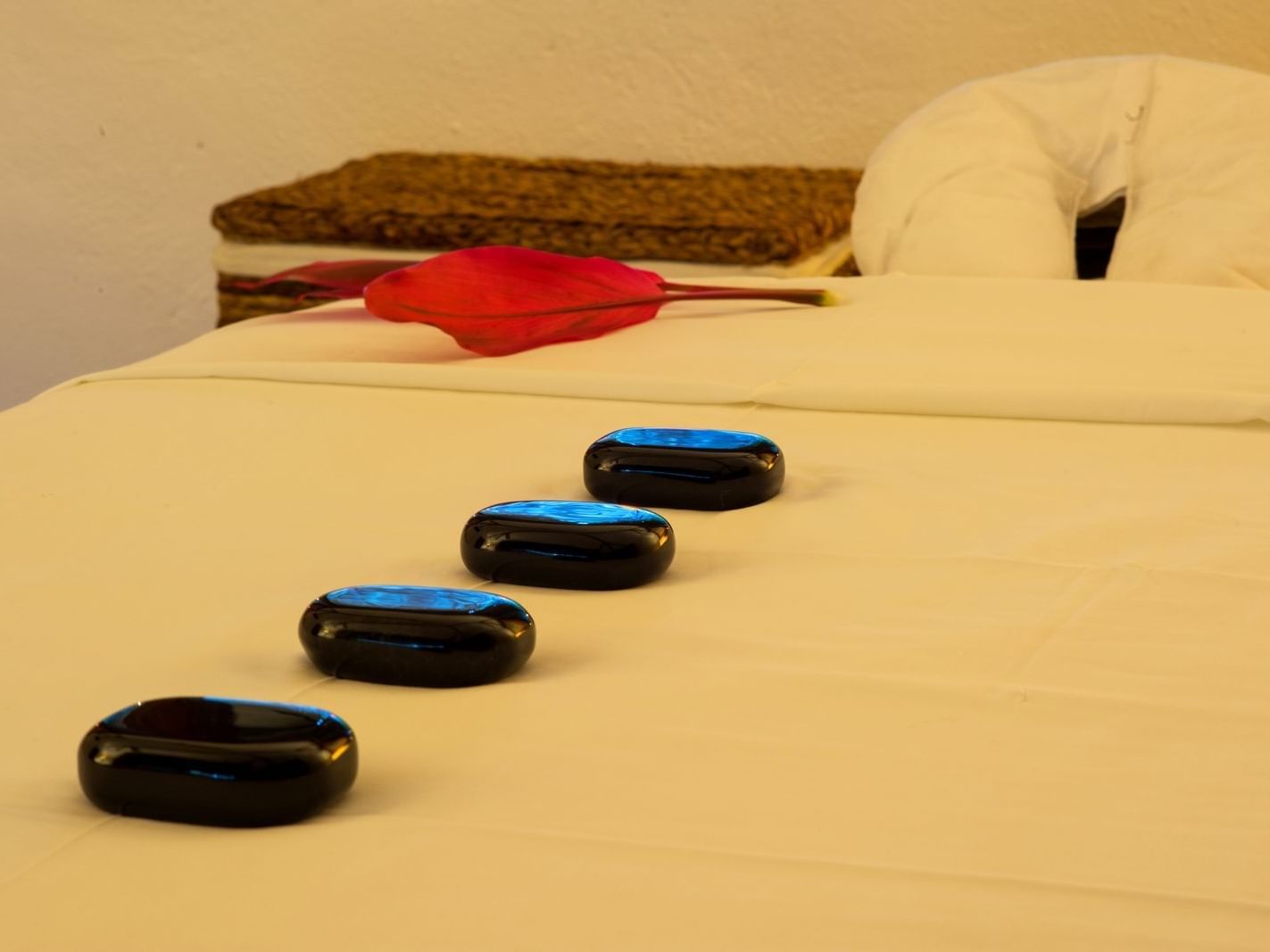 Message stones on a spa bed in a spa at La Colección Resorts