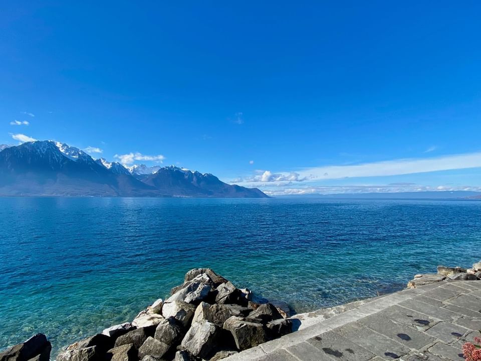 Lake Geneva with a backdrop of rugged mountains near Starling Hotel Lausanne