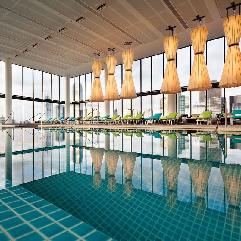 Indoor pool with sunbeds at Crown Metropol Melbourne