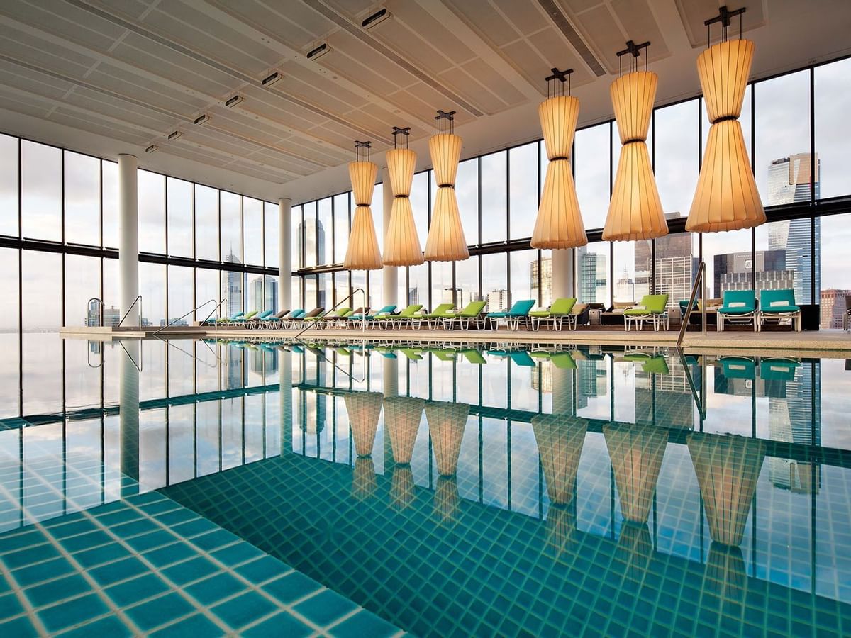 Indoor pool with sunbeds at Crown Metropol Melbourne