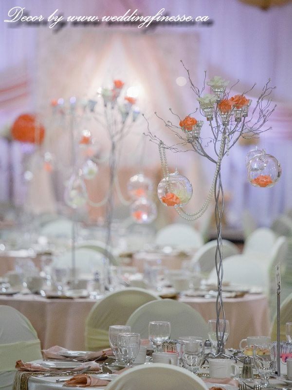 Close-up of glass and flower decor on a decorated table in an event hall at The Glenmore Inn & Convention Centre