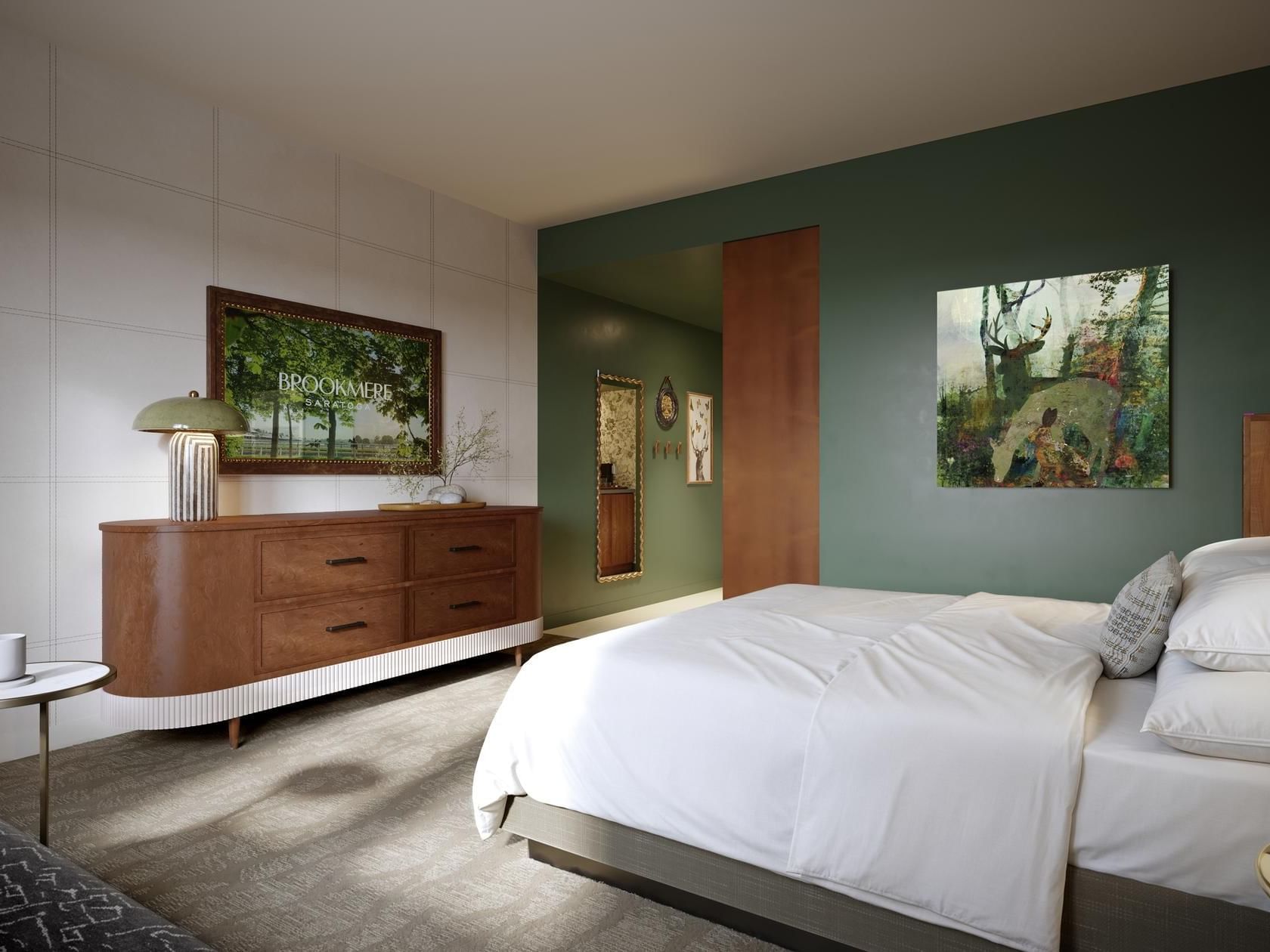 Interior of Accessible King with an elegant wooden dresser and carpeted floors at Hotel Brookmere