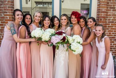Bride & bridesmaids taking a photo at Horton Grand Hotel