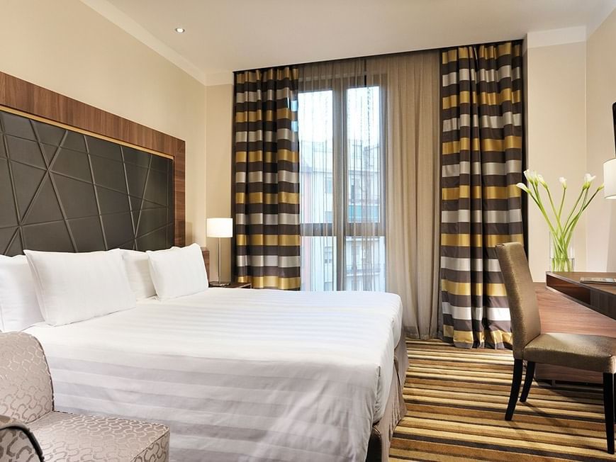 Classic Twin bedroom with Bed & Furniture at Extro Hotels