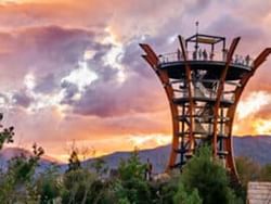 The AnaVista Tower against a sunset sky near the Wander Hotel