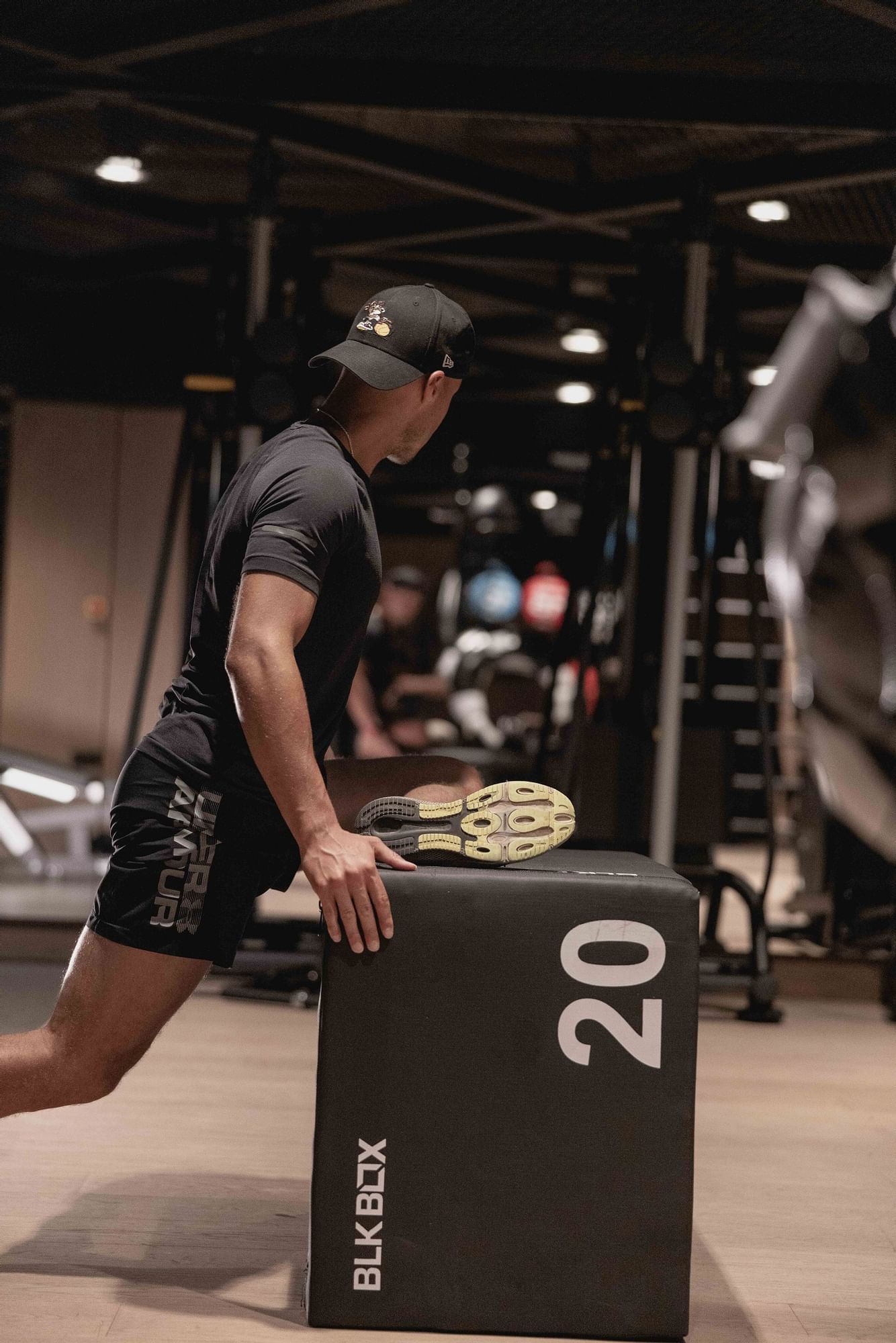 A person in athletic wear fitness training in the modern gym at The Londoner Hotel