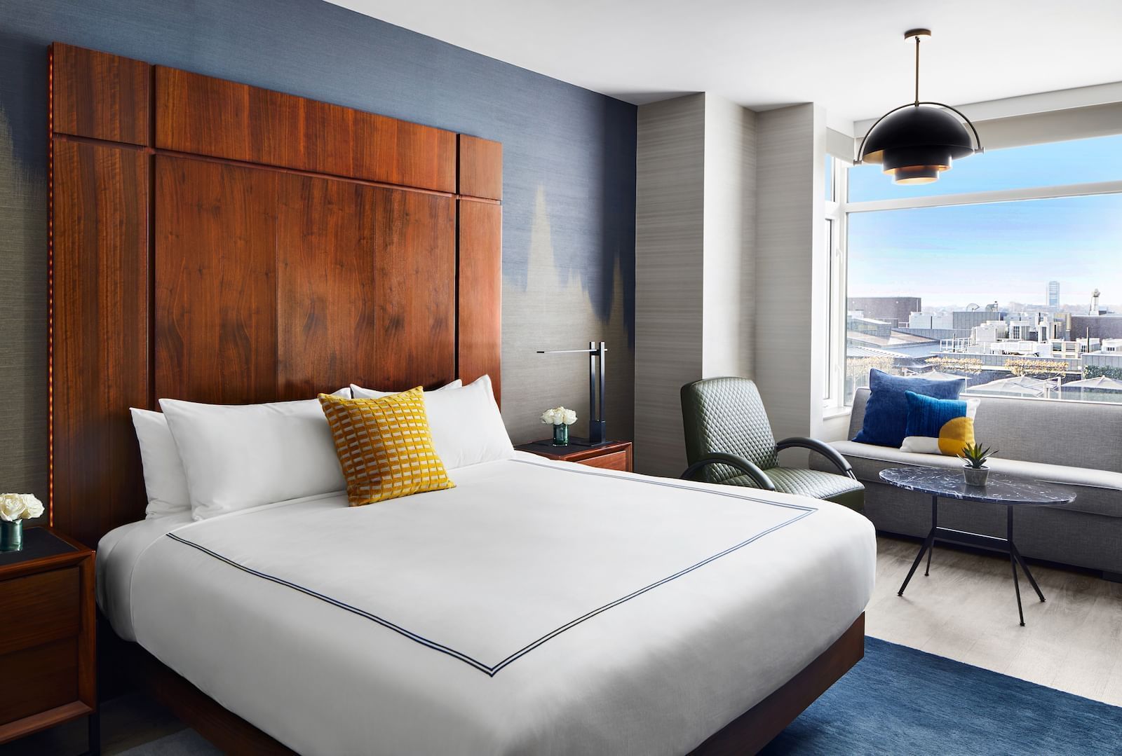 Gansevoort Meatpacking Grand Deluxe King Guestroom with Hudson River views, sofa bed, florals and a seating area