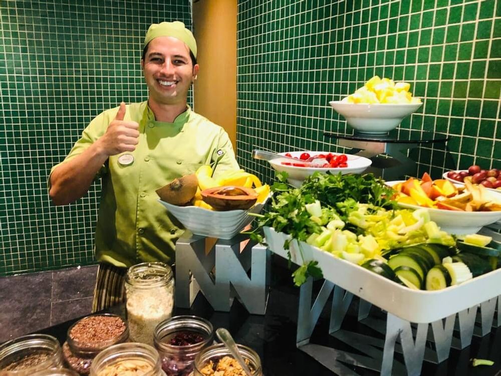 Chef standing by a Salad Bar at Live Aqua Resorts