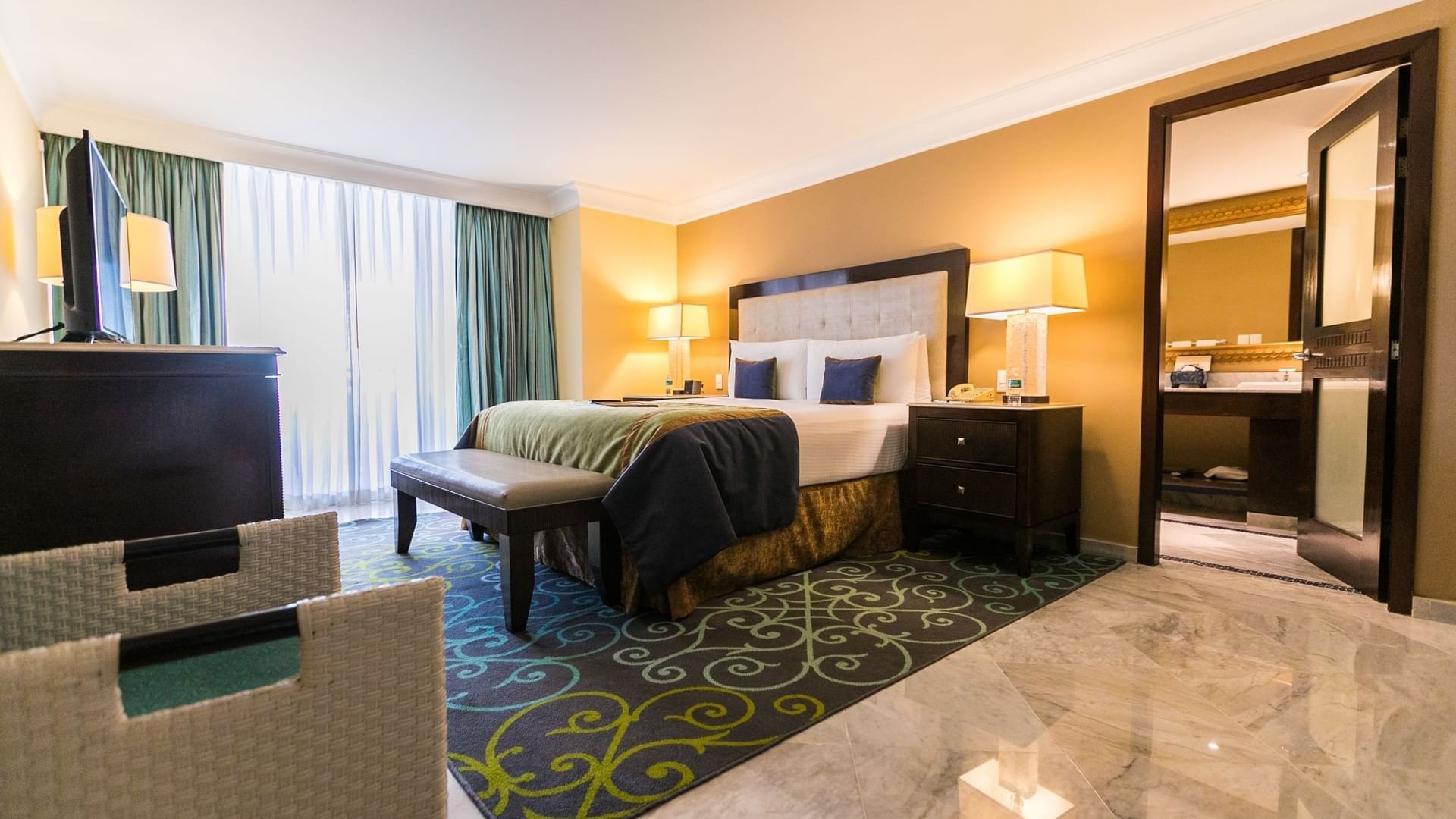King bed in Perla Ocean View Penthouse at Mundo Imperial