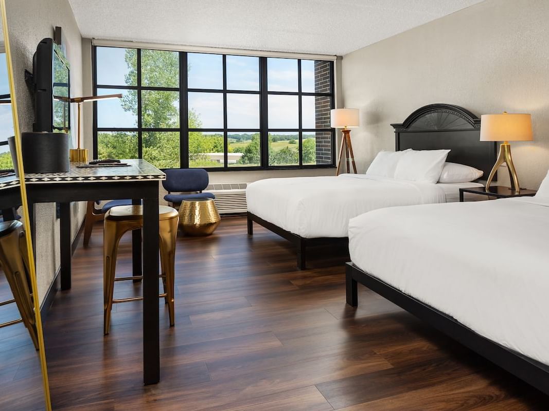 Two queen beds in a hotel room