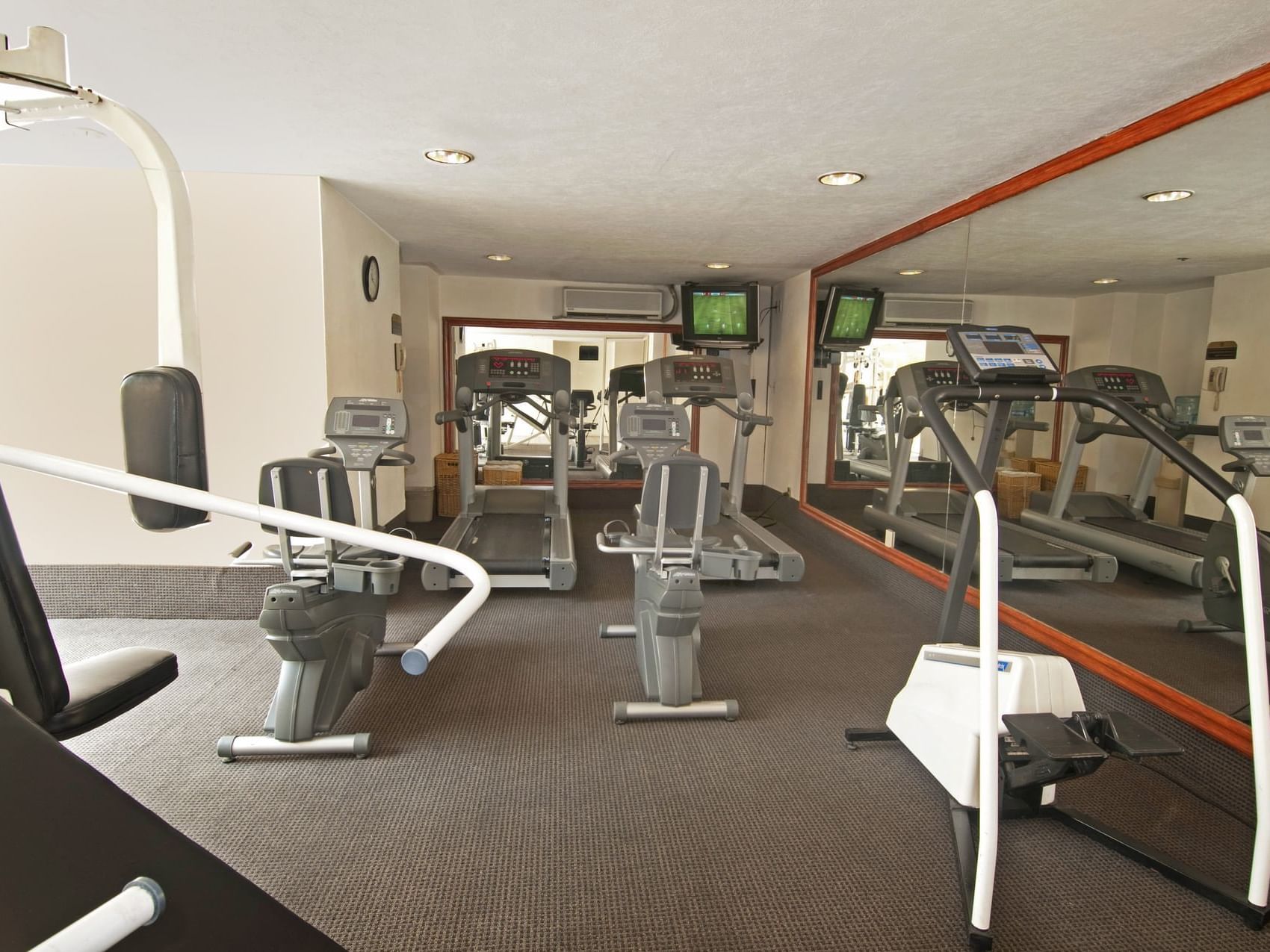 Exercise machines in a Gym wellness center at Fiesta Inn Hotels