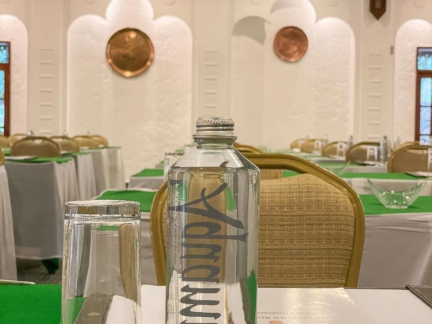 Water bottles on Baobab tables at Serena Beach Resort & Spa