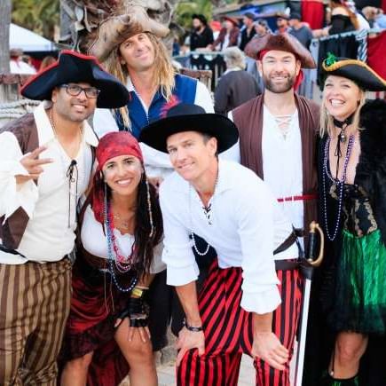 A group of people in pirate costumes posing for a photo at Catalina Island Company