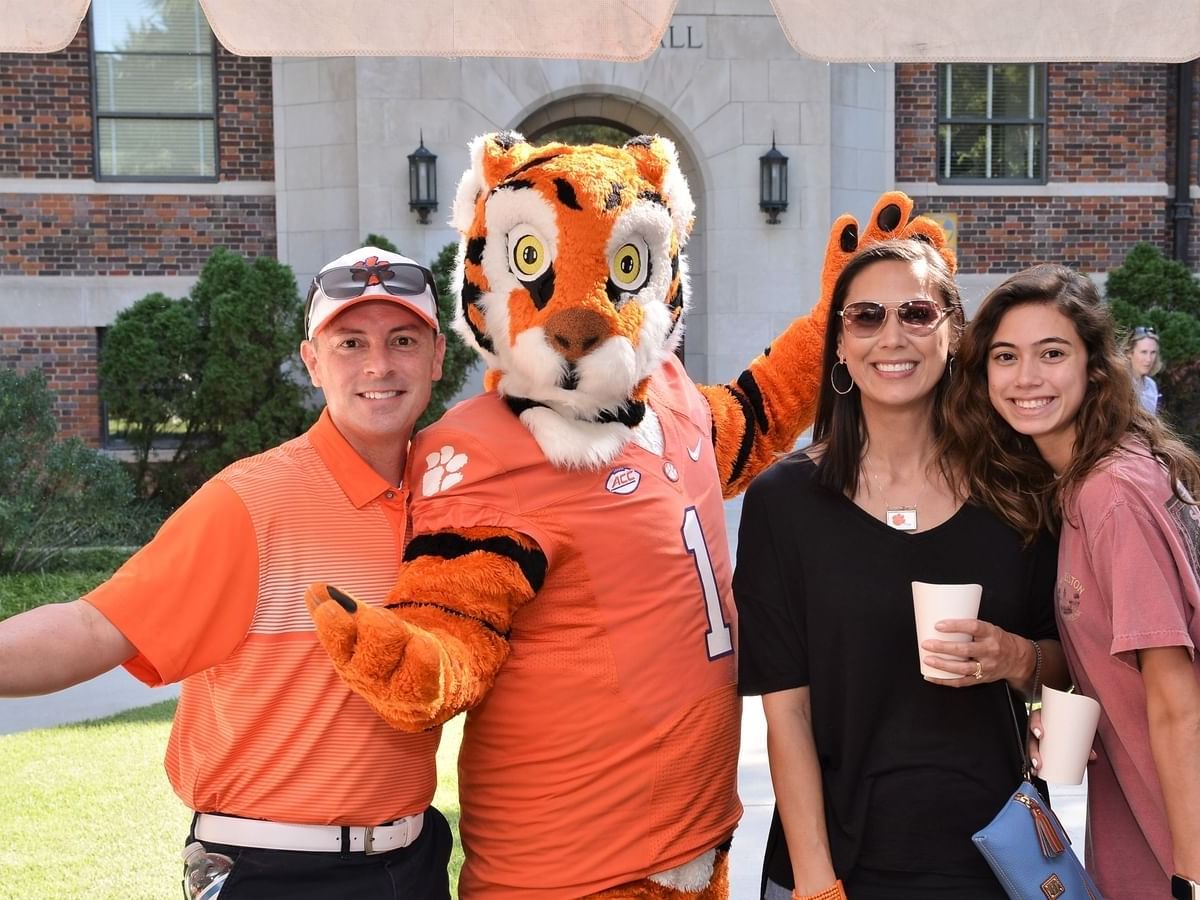 tiger mascot posing with clemson fans