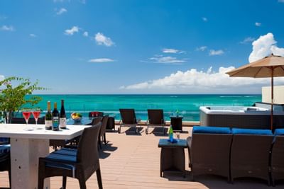 Ocean view from rooftop terrace with sun loungers at Windsong Resort On The Reef