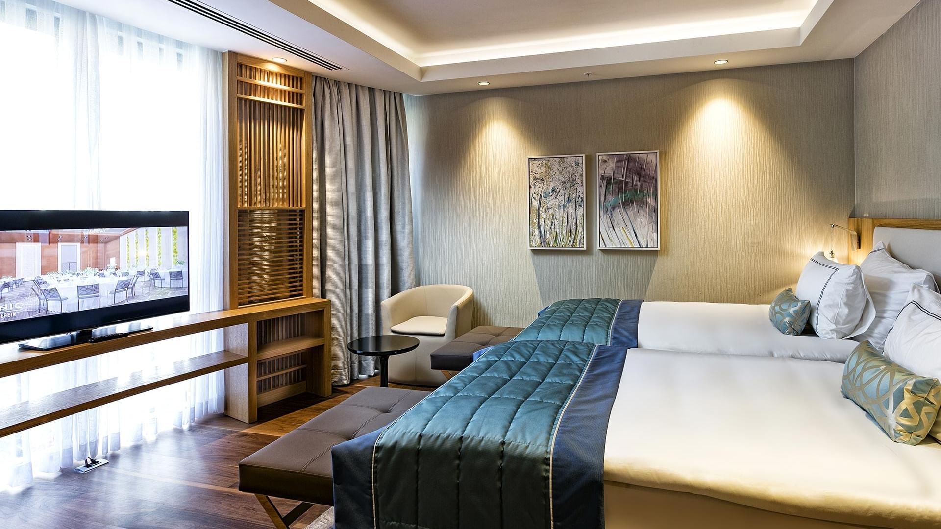 Twin beds in Presidential Villa with wooden floor at Titanic Luxury Collection Bodrum