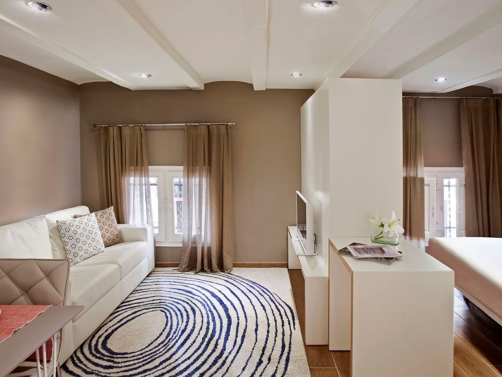 Bedroom & lounge area in Standard room at Barcelona Apartment