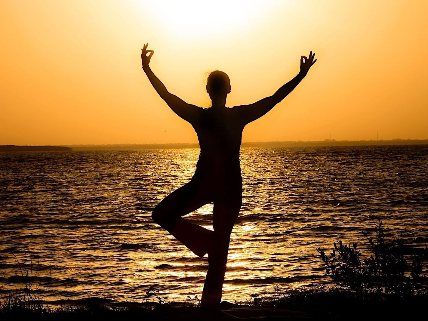 Girl doing Yoga by the beach near Safety Harbor Resort & Spa