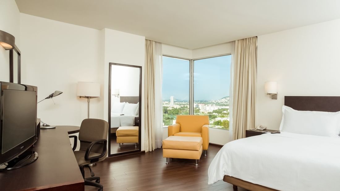 Bedroom arrangement in Junior suite at Fiesta Inn Hotels
