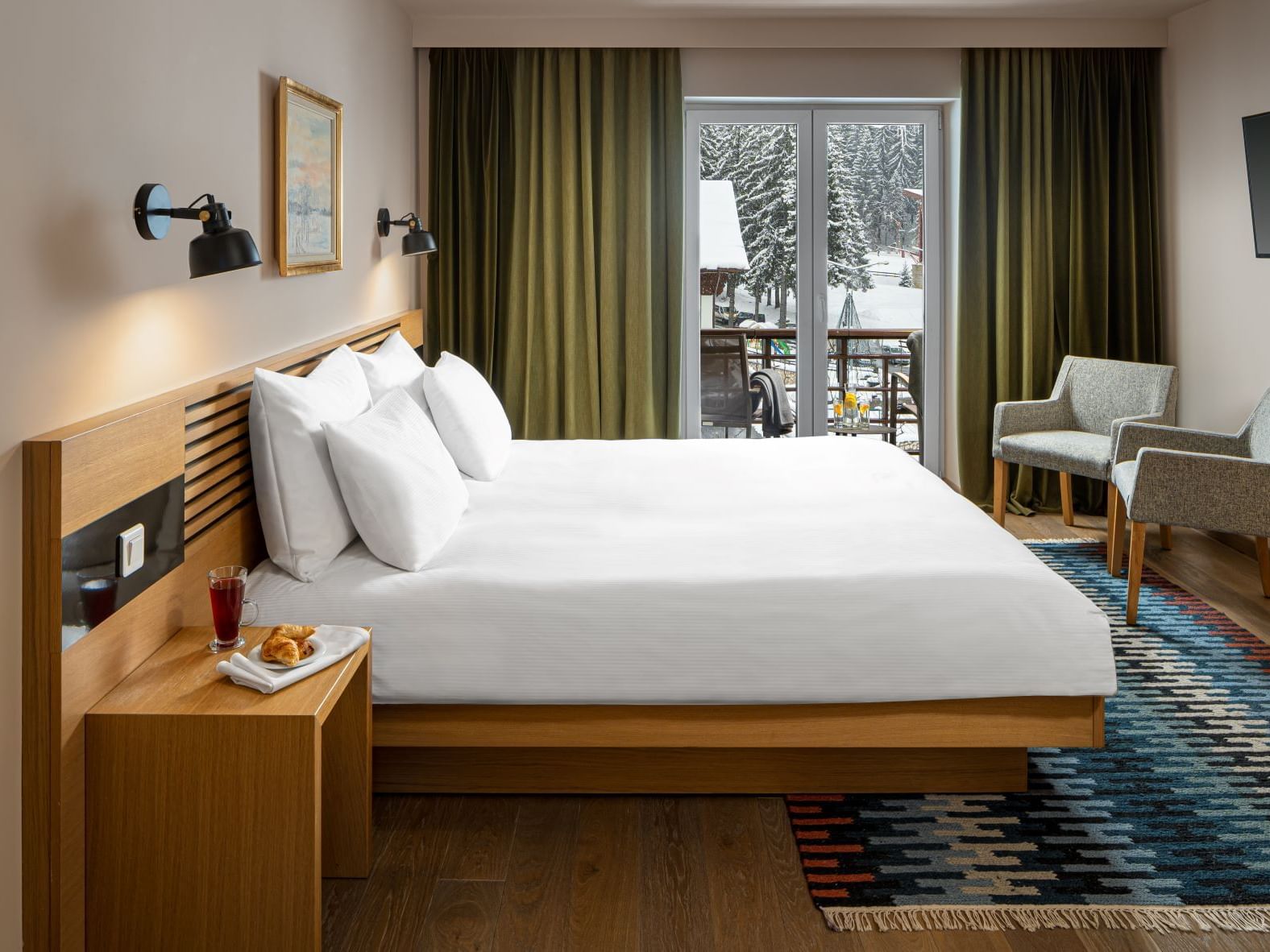 King Junior Suite bedroom with balcony area at Ana Hotels Sport Poiana Brașov