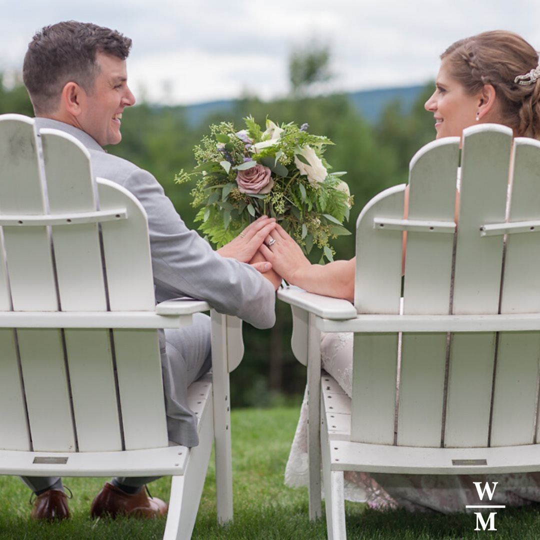Wedded couple posing in chairs at White Mountain Hotel