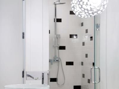Image of the walk in shower that includes a rain shower head and