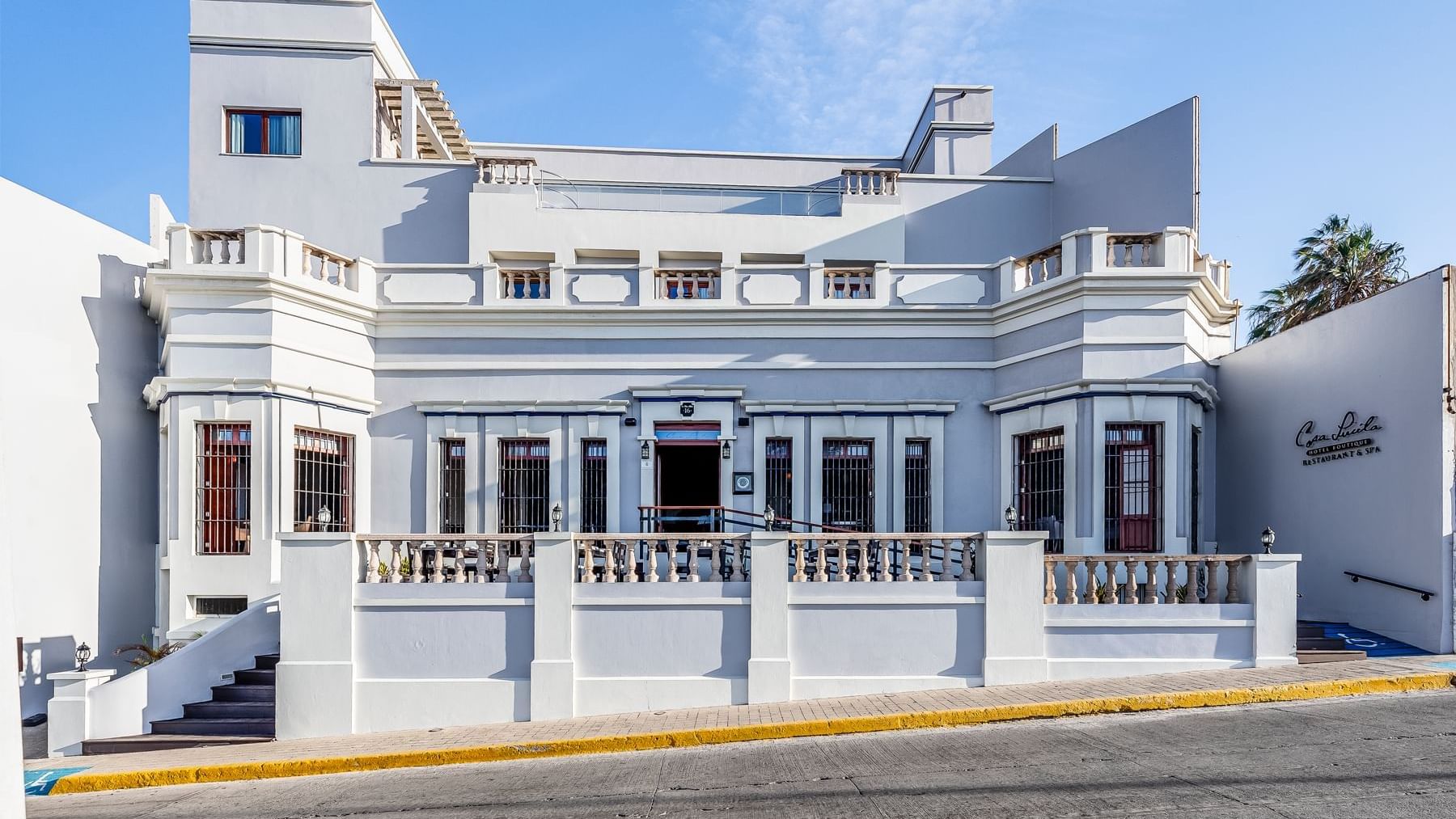 Exterior view of Curamoria Collection front entrance, and street-side presence