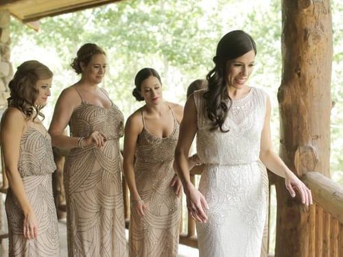 A bride posing with her brides maids at Stein Eriksen Lodge