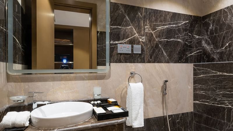 Bathroom vanity with mirror in Junior Suite at Warwick Riyadh