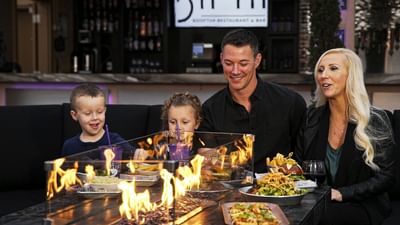 A family dining at Hotel Grand Legacy at The Park Anaheim.