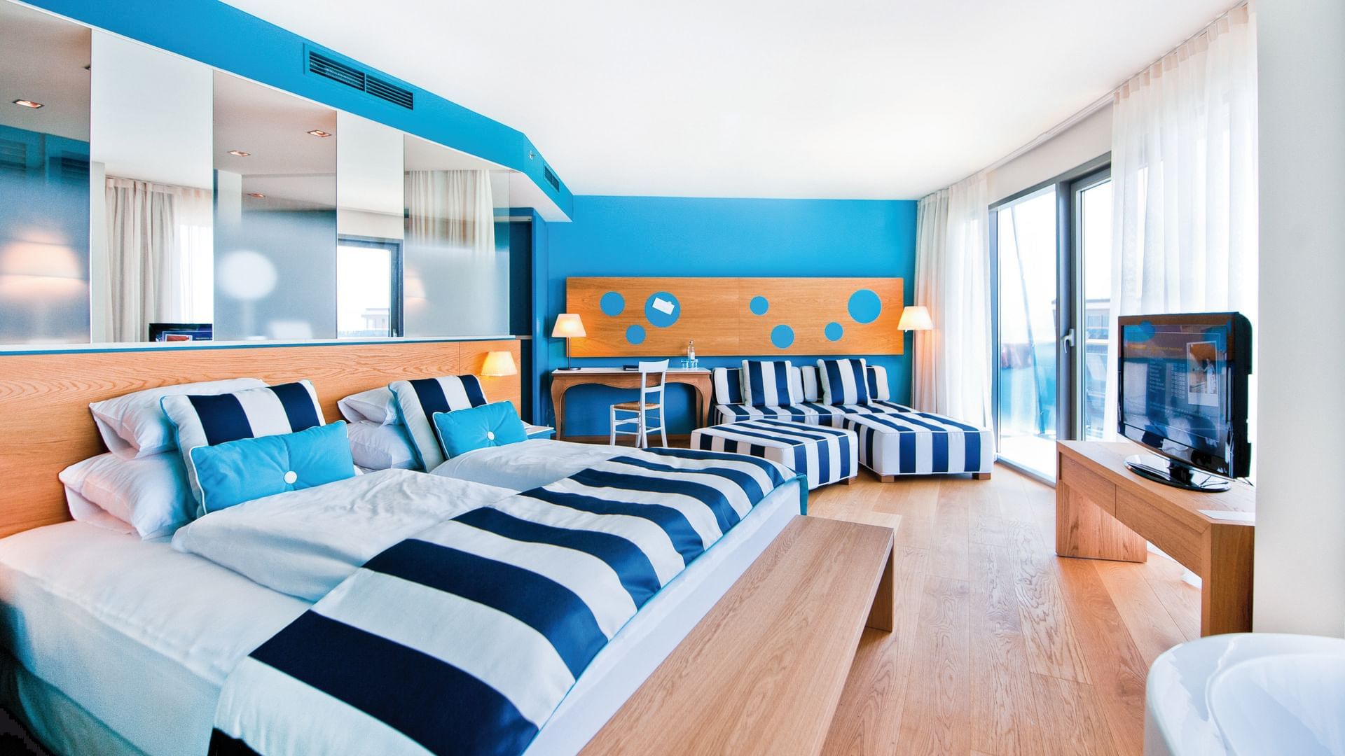 Large bed & lounge in Junior Sea side at Falkensteiner Iadera