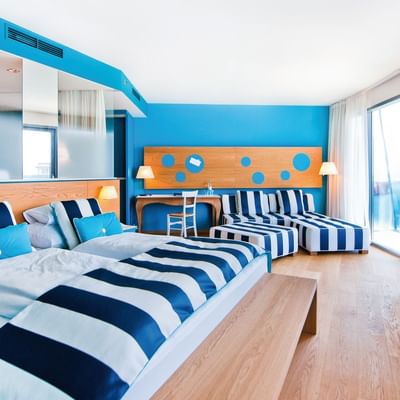 Large bed & lounge in Junior Sea side at Falkensteiner Iadera