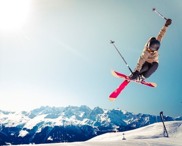 Man skiing with a scenic view near Blackcomb Springs Suites