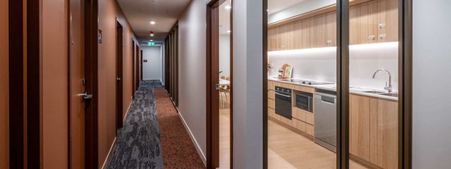 Long hallway with kitchen view in Single Room at UniLodge Brisbane City.