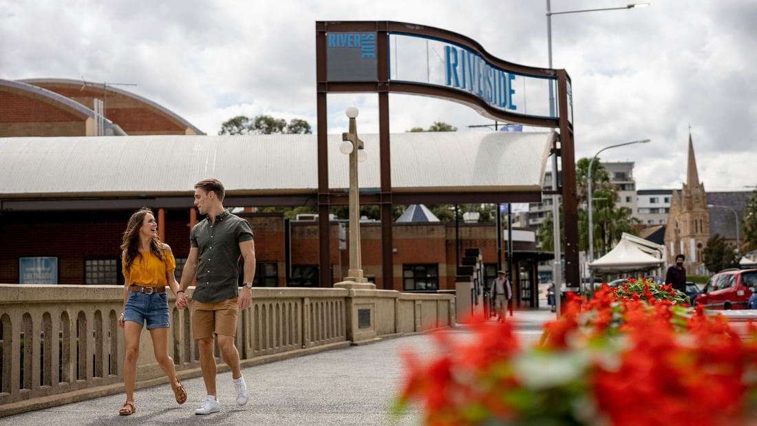 Couple walking under a 