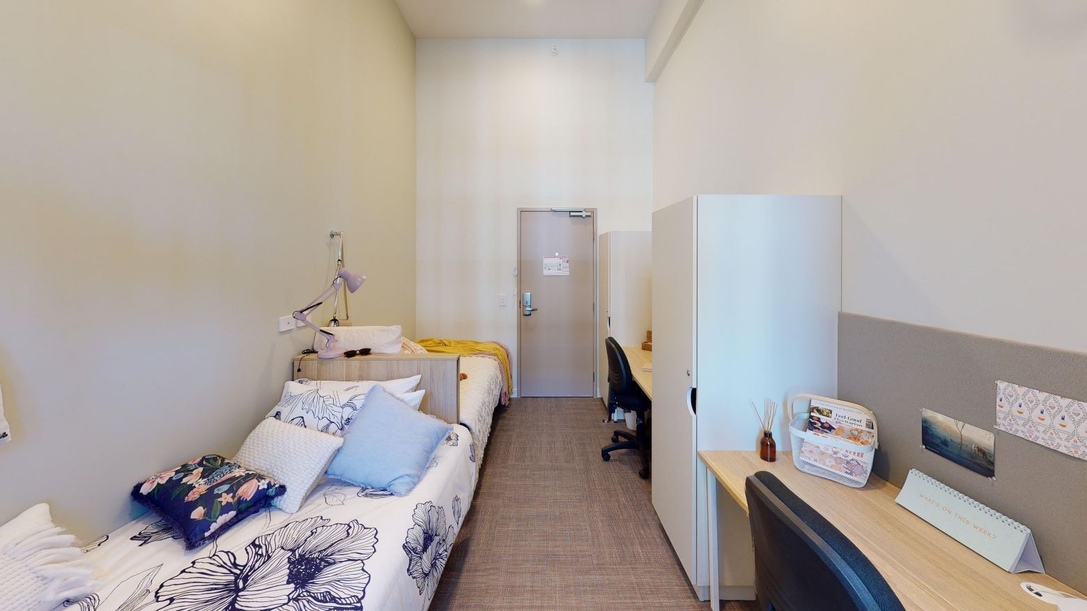 Twin Room with two beds, two desks and two wardrobes at UniLodge Herston.