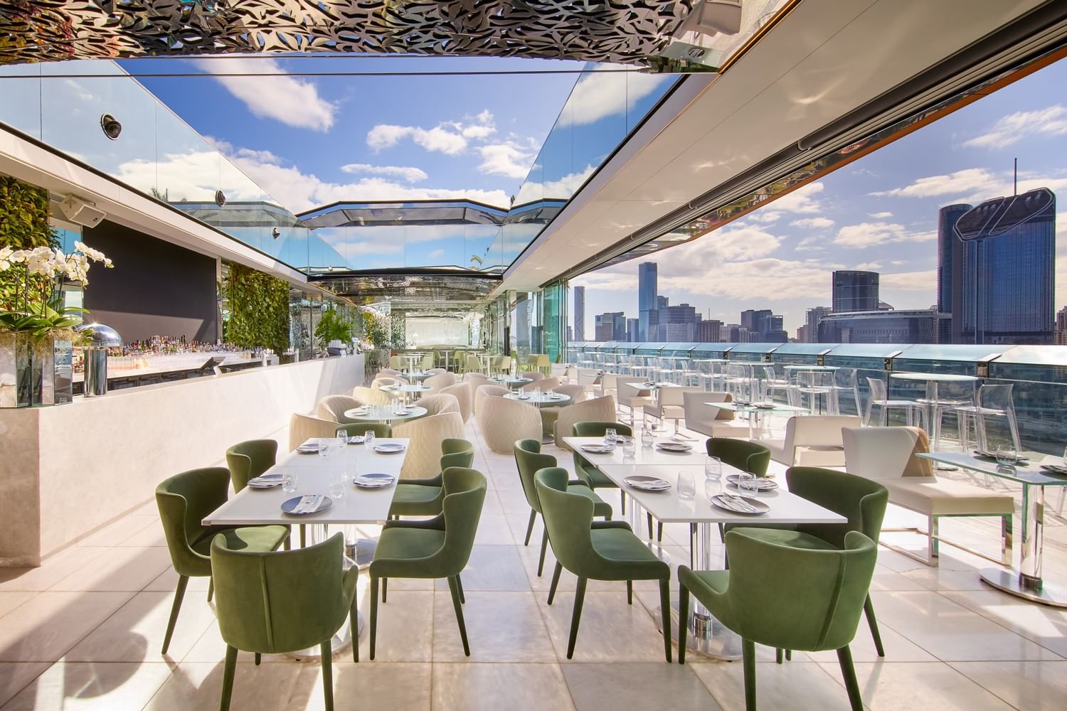 The Terrace rooftop bar with open roof and various table and chair settings