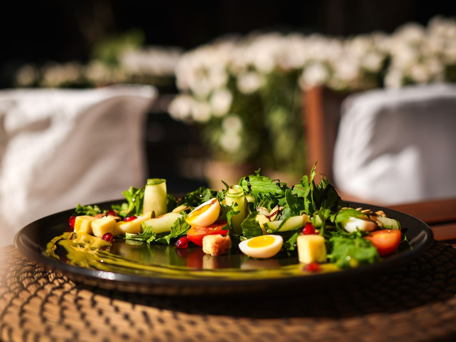 Vibrant salad served on a black plate in Toran Restaurant at Dwarika's Hotel Kathmandu