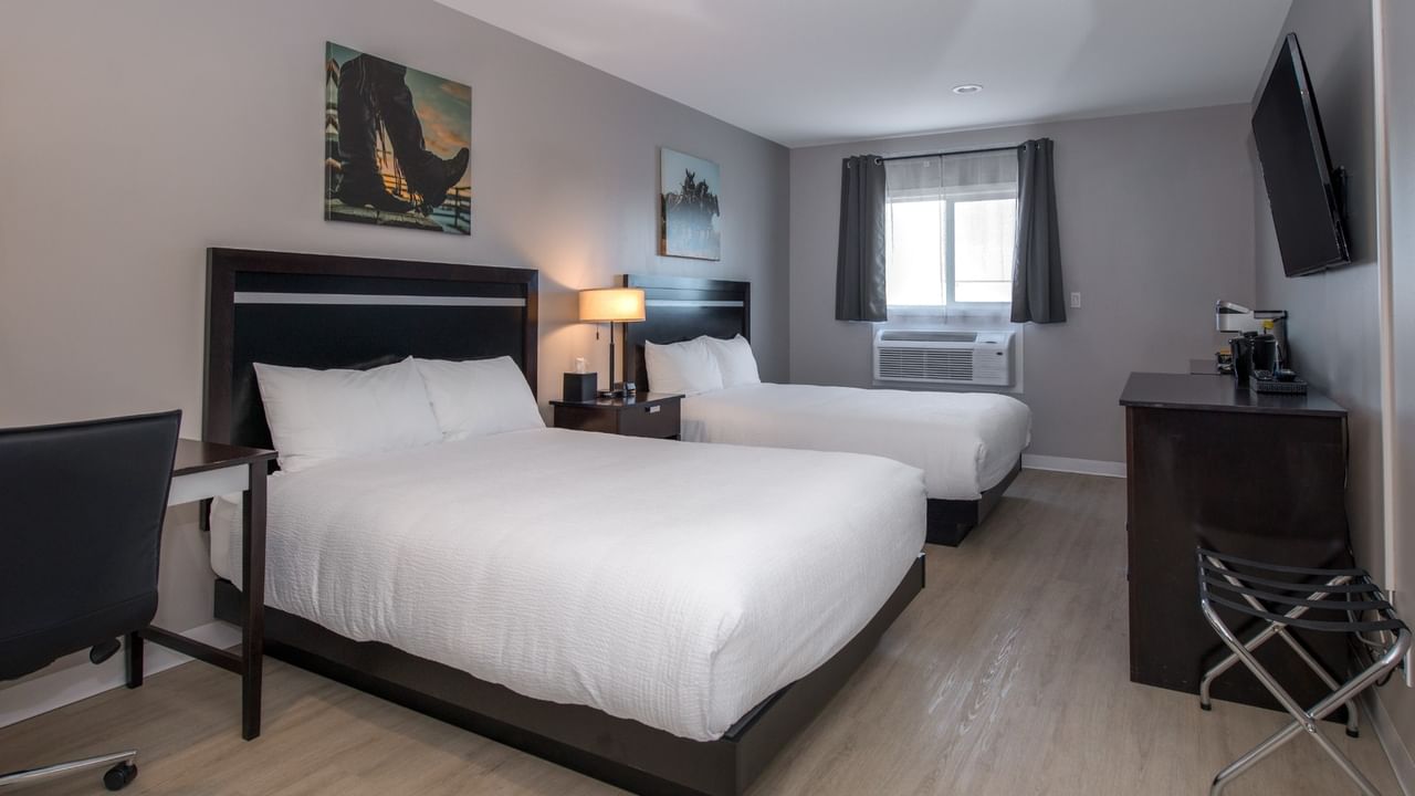 Accessible Two Queens room at Coast Innisfail Hotel with two queen beds, desk and TV