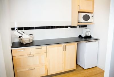 The kitchenette in 1-Bedroom Suite Double at Aqua Hotel