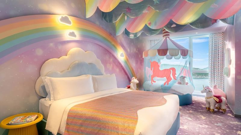 Bed in Rainbow Unicorn Room at Fullerton Ocean Park
